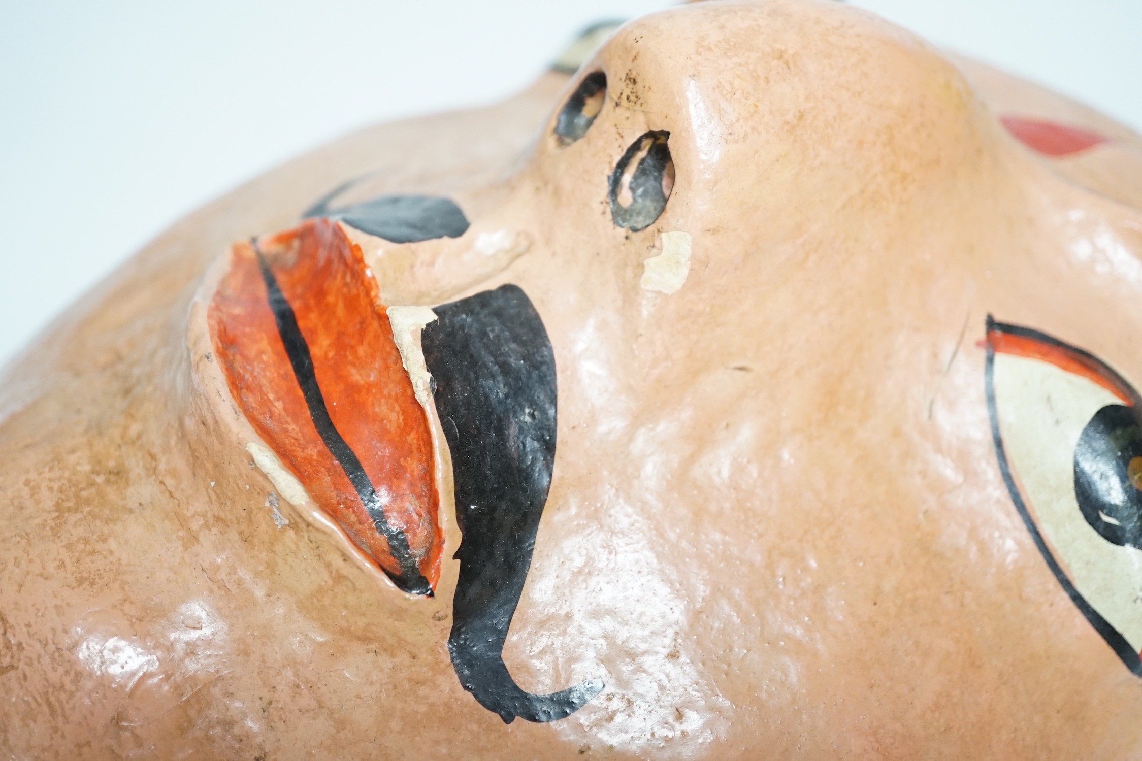 A papier mache wall mask of an Indian gentleman 32cm long